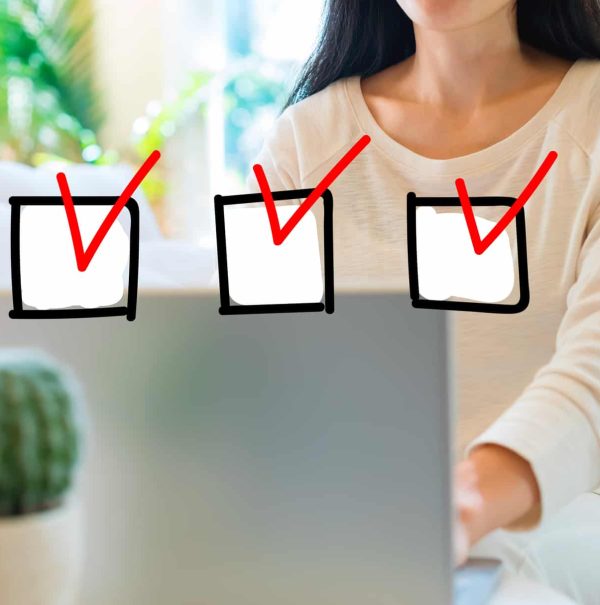 Woman using her laptop in her home office to perform Website Audits